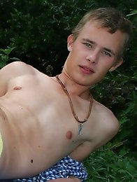 Blond boys masturbating and pissing outdoors