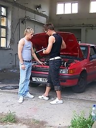 Two muscular gay guys suck dicks at the auto workshop